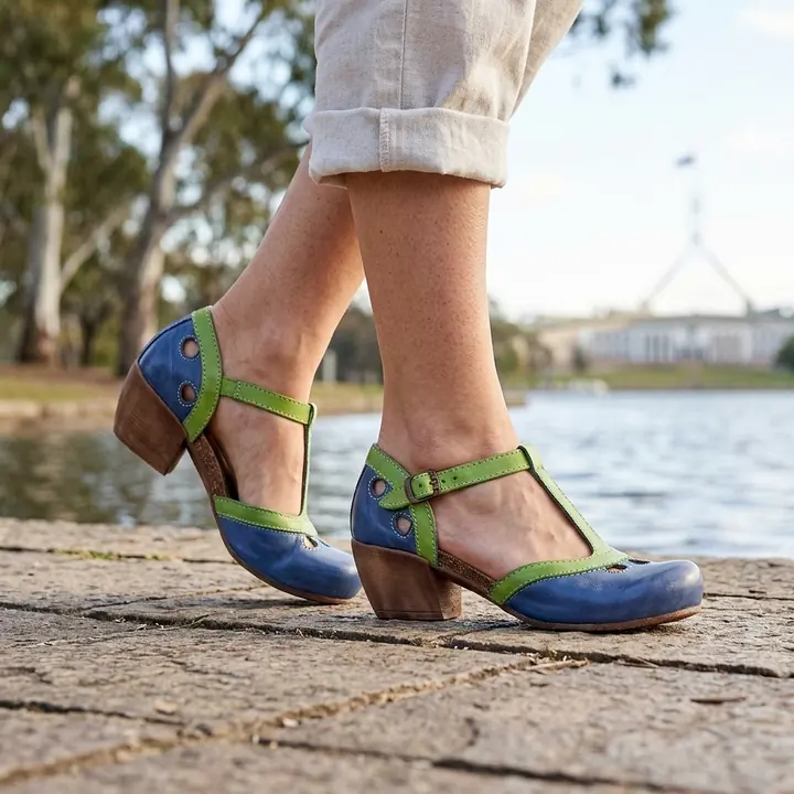 AI product photo: blue and green leather sandals, on location
